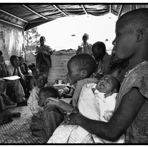 THE CHILD IN THE PHOTOGRAPH WAS ONE OF 120,000 ESTIMATED LOST CHILDREN DURING THE RWANDAN GENOCIDE IN JULY OF 1994. THE CHILD'S NAME WAS REDUCED TO A NUMBER IN ORDER TO PROTECT HIM FROM THE PERPETRATORS OF THE GENOCIDE.